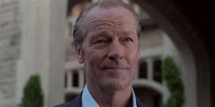 Iain Glen outside Wayne Manor as Bruce Wayne.