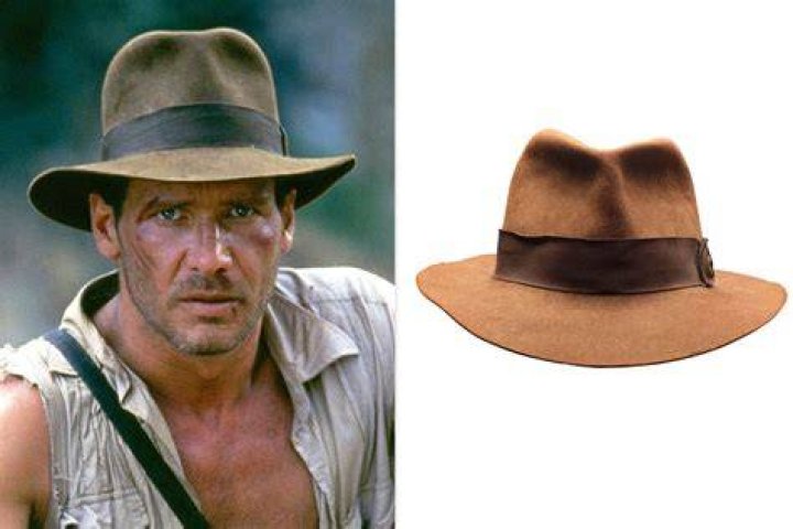 Indiana Jones adjusts his fedora when seeing the snake statue in Temple of Doom