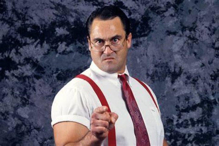 Irwin R. Schyster with his arms open.