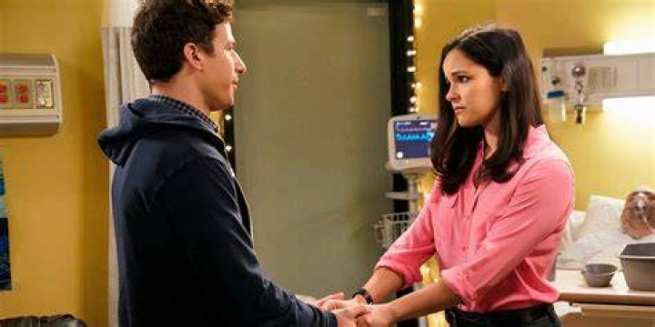 Jake and Amy talk in bomb suits
