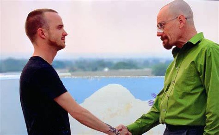 Jesse and Walt shaking hands in Breaking Bad.