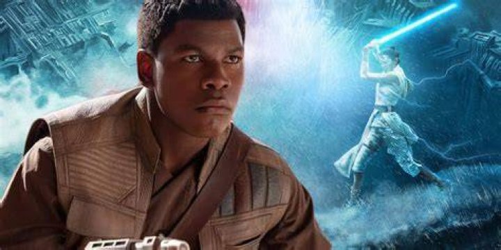 John Boyega raising his sword as King Ghezo in The Woman King
