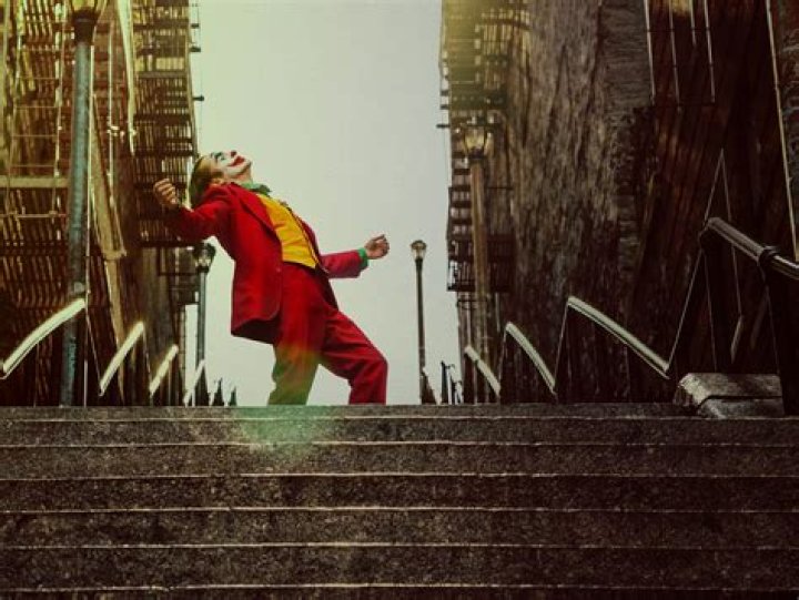 Joker's greek god form beside standard Joker
