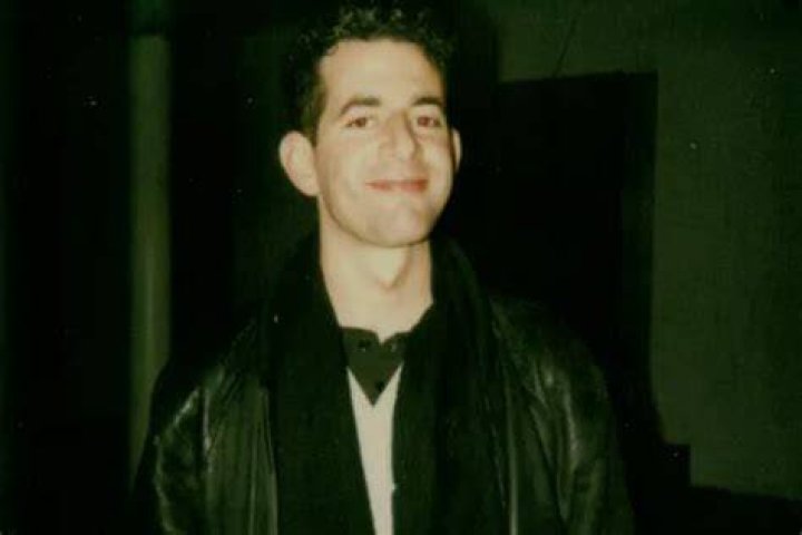 Jonathan Larson talking and looking at someone intently in tick, tick... Boom!