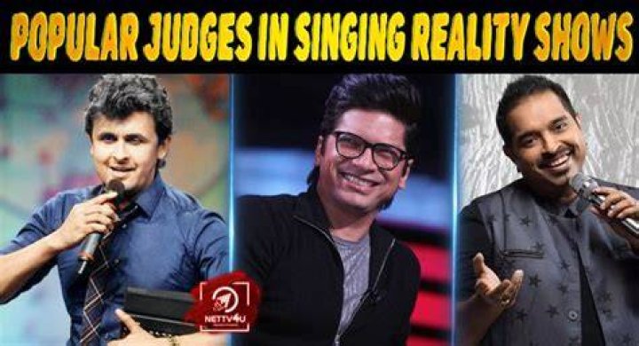 Judges from the reality singing competition series Songland sitting in their chairs, including John Legend and Ryan Tedder