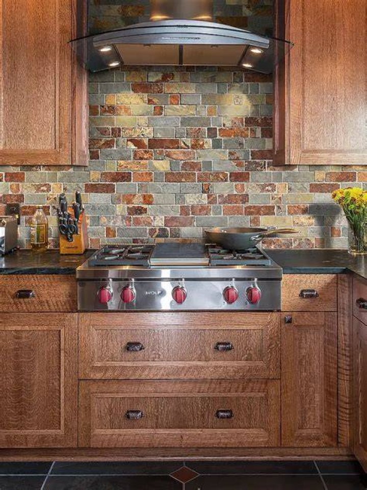 Kitchen with two tile backsplashes