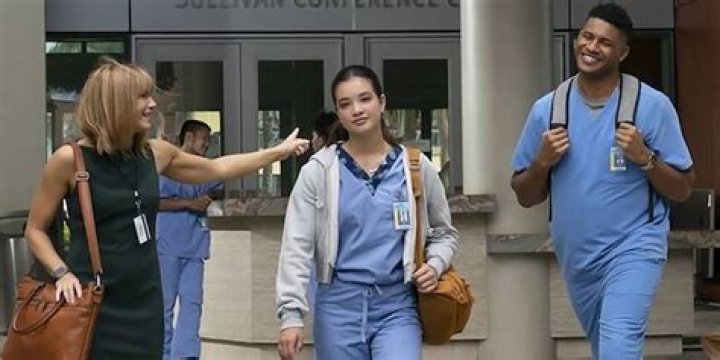 Leleha & Doogie Kameahola walking with others from the hospital from the Disney+ series.