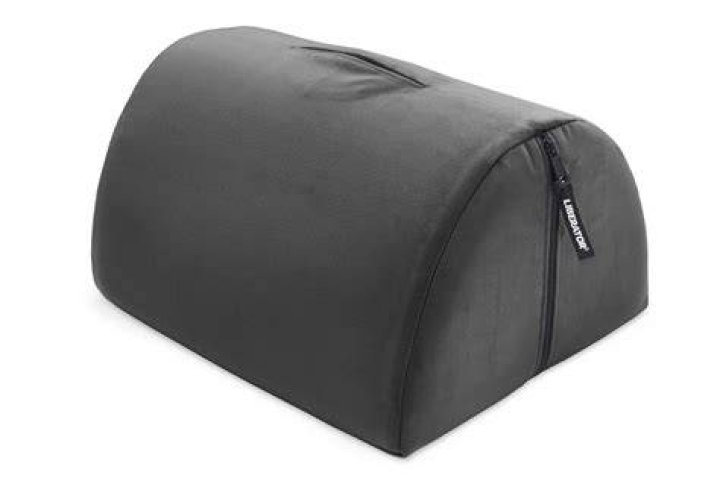 liberator bon bon pillow, one of the best sex pillows, in pink