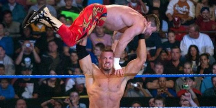 Luther Reigns lifting Eddie Guerrero up