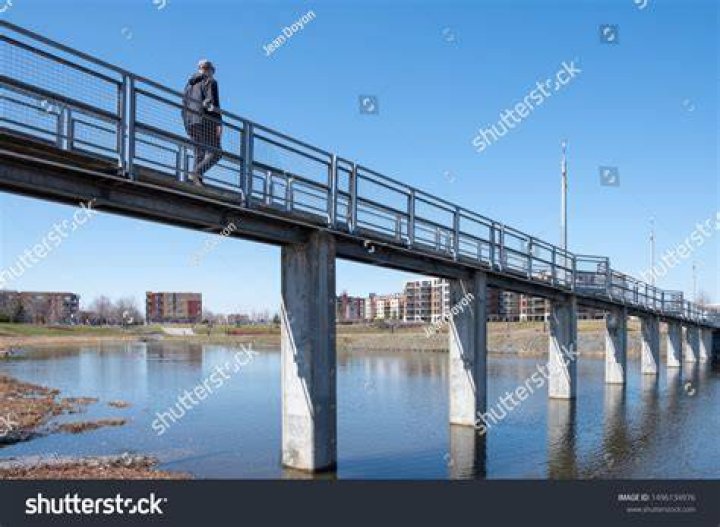 Man on small bridge, St Andrews, Scotland