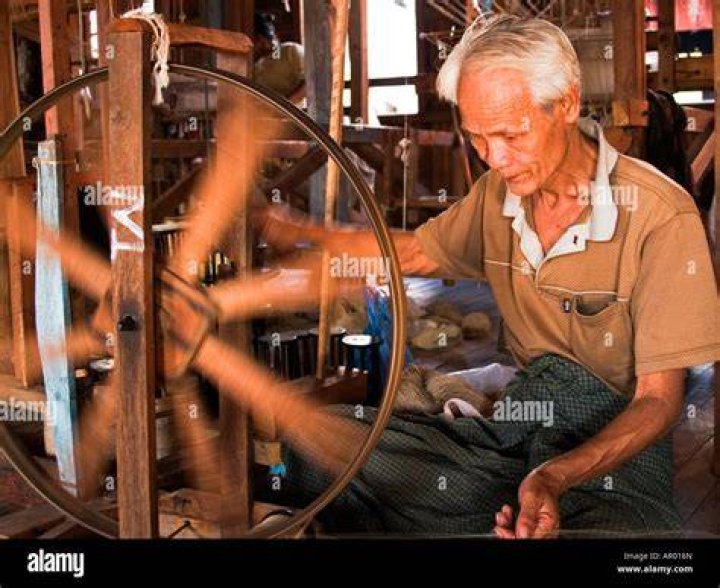 Man spinning silk in Myanmar