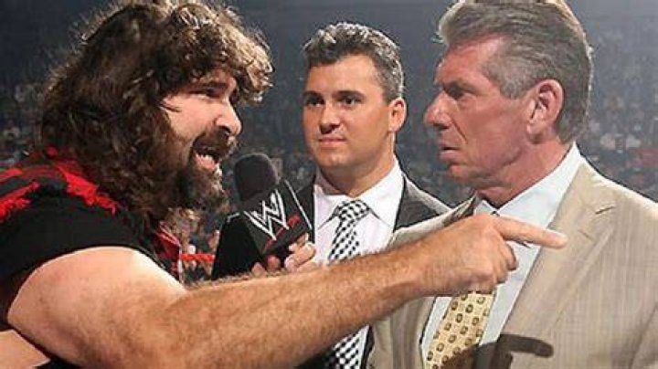 Mankind entertains Vince McMahon with Mr. Socko
