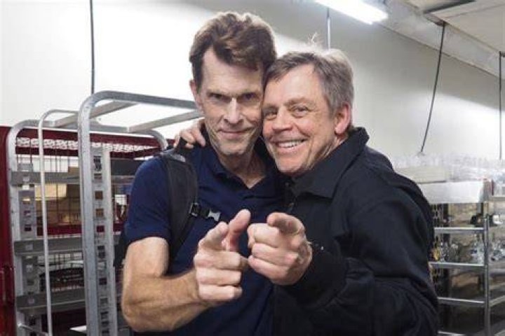 Mark Hamill holding up hands in The Machine