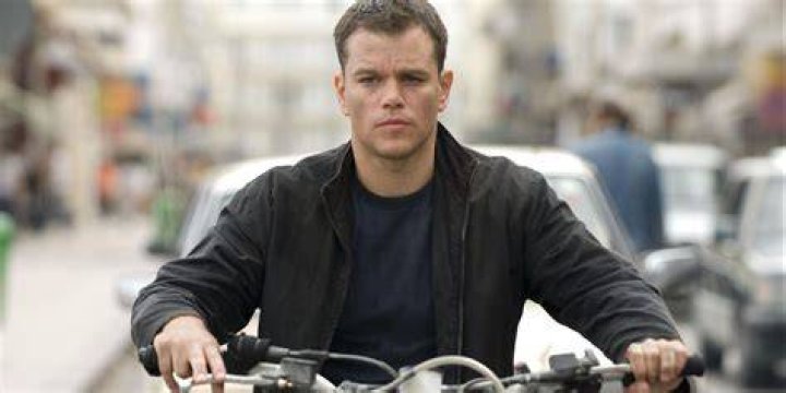 Matt Damon riding a motorcycle in Jason Bourne