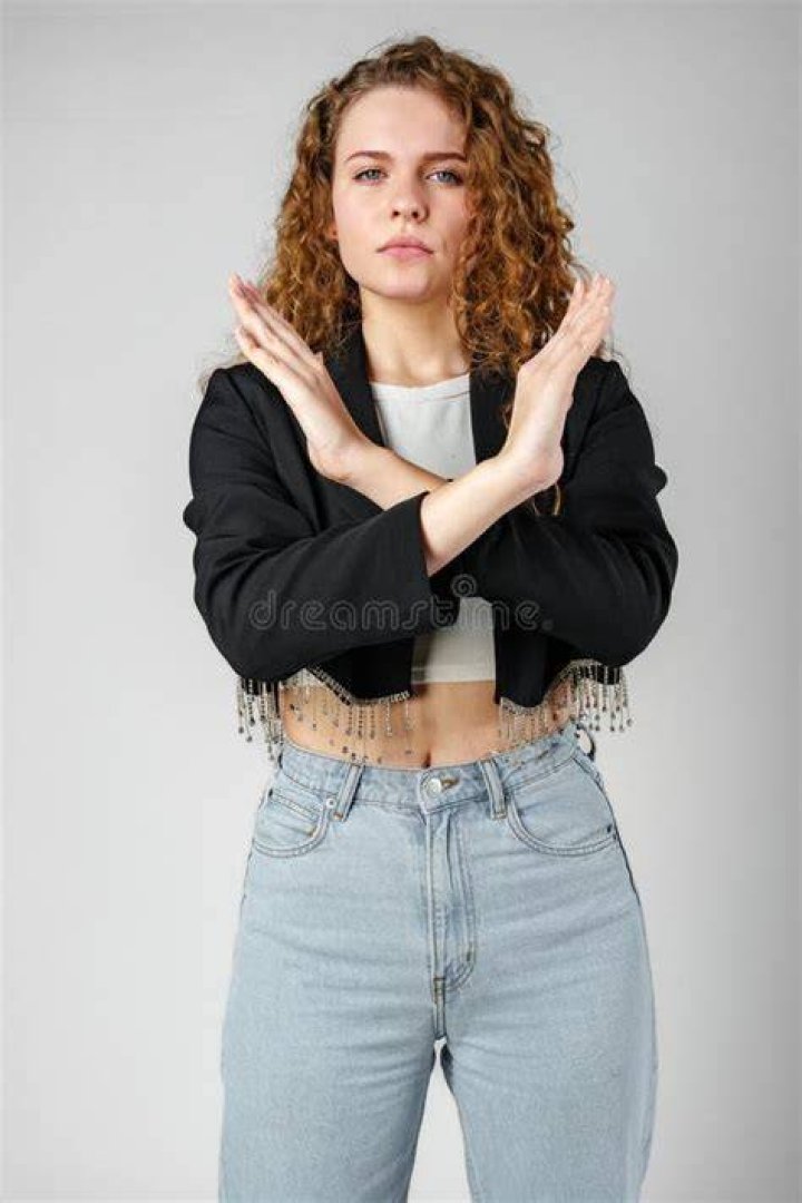Max standing with her arms crossed in The Walking Dead