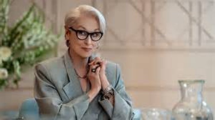Miranda looking over her glasses at her desk in The Devil Wears Prada