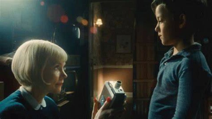 Mitzi Fabelman With Young Sammy Watching His Train Movie In The Fabelmans.jpg