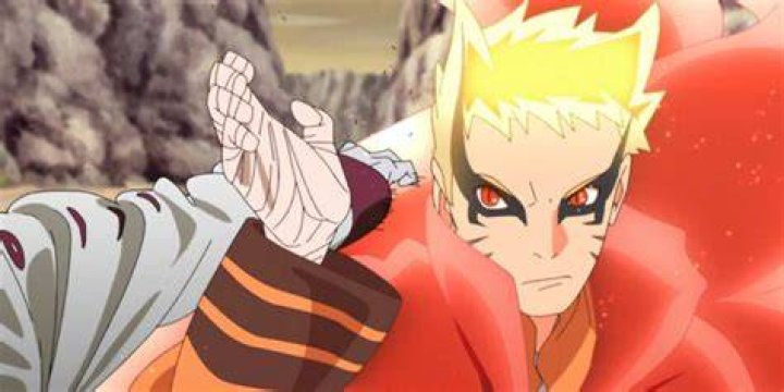 Naruto blocks a blow from Isshiki in Baryon Mode in Boruto