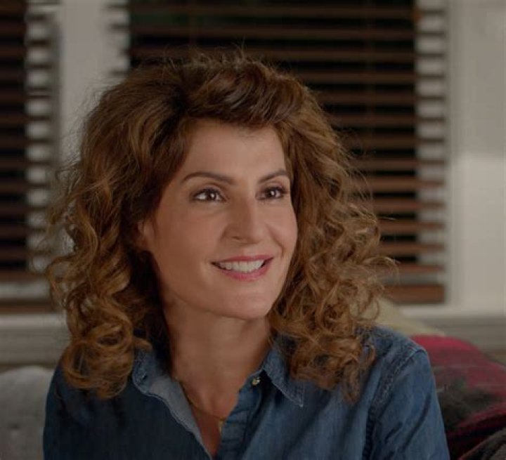 Nia Vardalos in My Big Fat Greek Wedding 3 with background of Toula and Ian in MBFGW2
