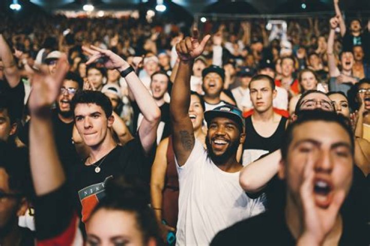 People, Crowd, Interaction, Event, Blond, Eyewear, Sunglasses, Hug, Sitting, Fashion accessory, 