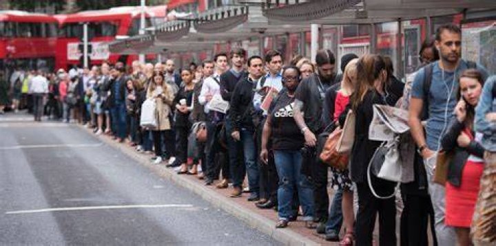 People queuing outside Moses Hair Salon in Soweto.