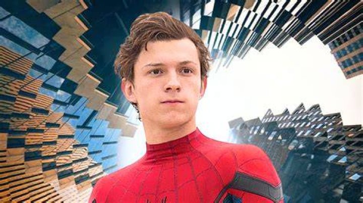 Peter Parker climbs on the side of a building in Spider-Man (2002)