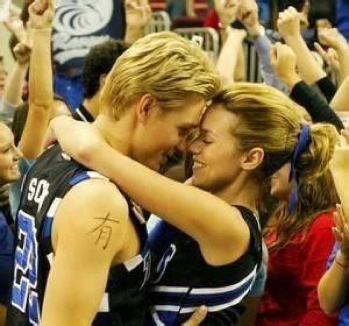 Peyton and Lucas kissing at a game