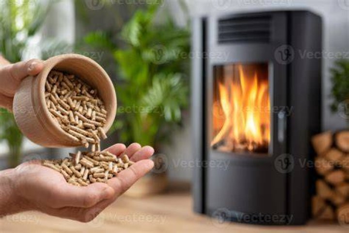 Pouring Smoke Wood Pellets into Ninja Woodfire Outdoor Oven