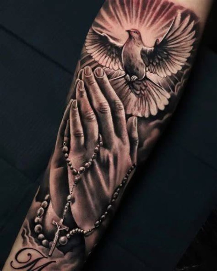 Praying hands tattoo
