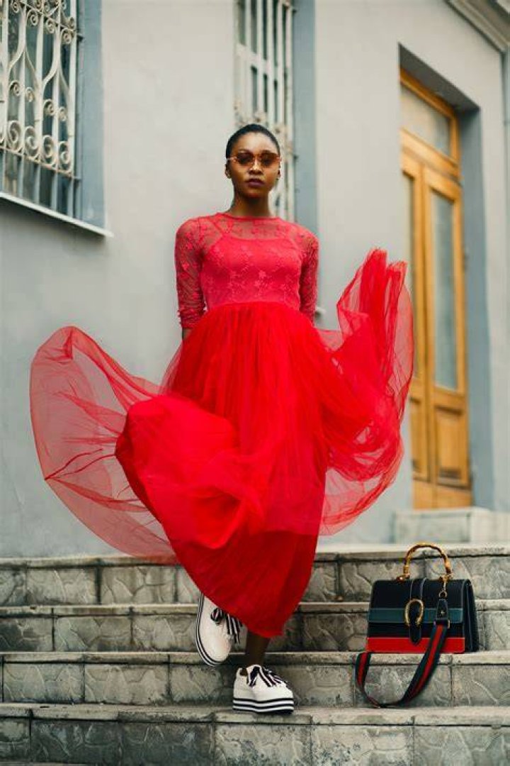 Red, Street fashion, Fashion, Transport, Mode of transport, Urban area, Snapshot, Footwear, Yellow, Standing, 
