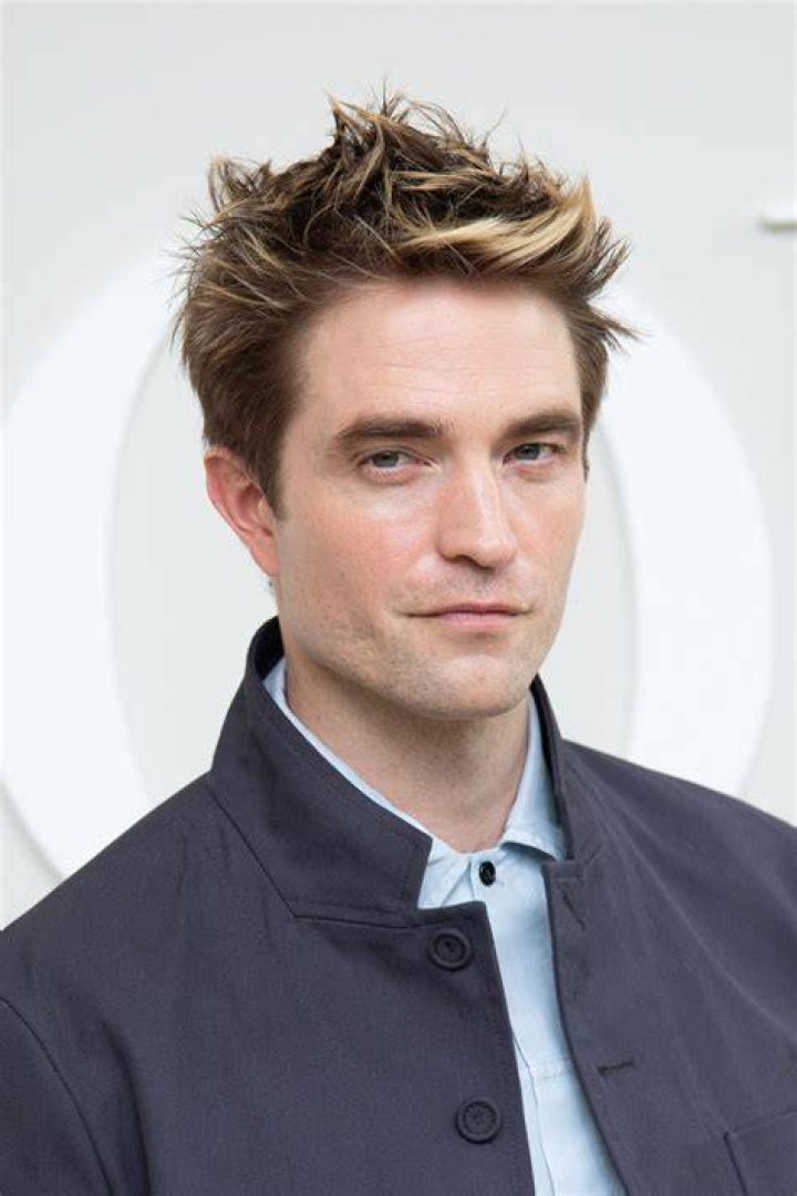 Robert Pattinson at a crime scene as Batman.