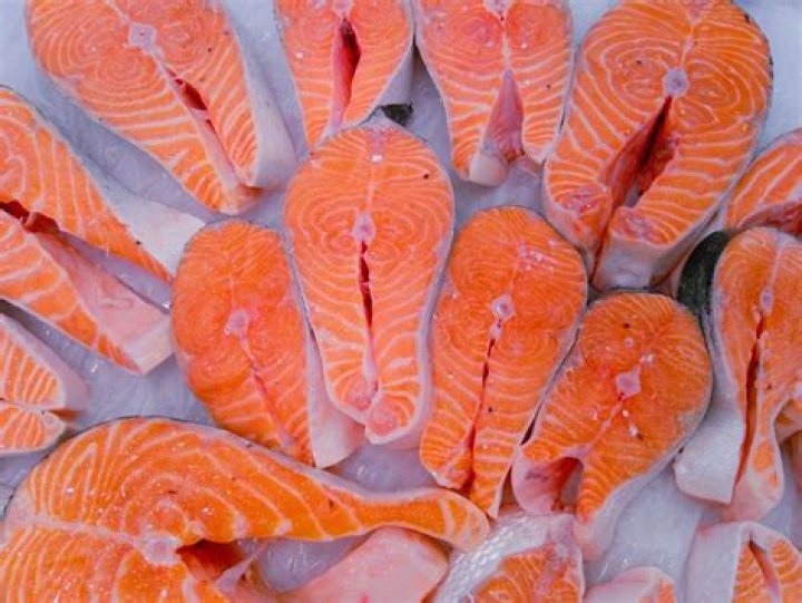 salmon on ice, waiting to be sold, on central market of valencia, spain