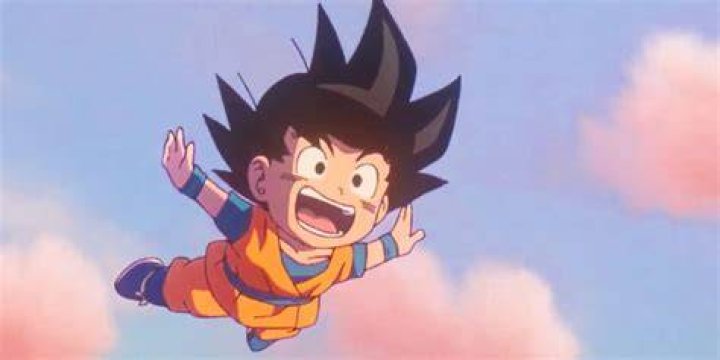 Screenshot from Dragon Ball Daima teaser shows a young Goku happily greeting the wise cat Korin on his lookout in the sky.