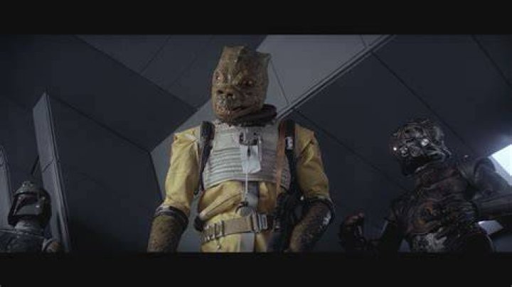 Split image of Bossk and Boushh from Star Wars, and E.T.