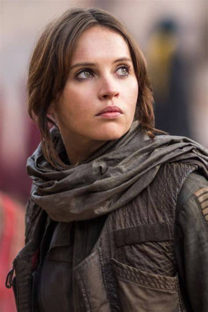 Split image of Jyn Erso wielding her blaster pistol behind cover and a luger