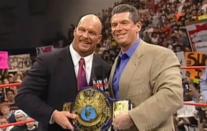Steve Austin hits Vince McMahon with a bedpan