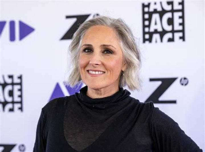 Swimsuitclad Ricki Lake takes a dip in the ocean during Mexican