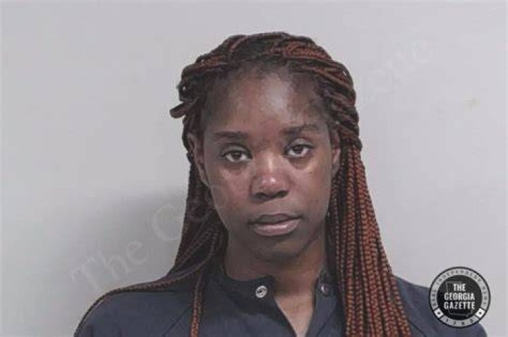 Tanaijsha Bruton's vehicle goes airborne after driving up the ramp of a flatbed tow truck on a Georgia highway. Photo / AP