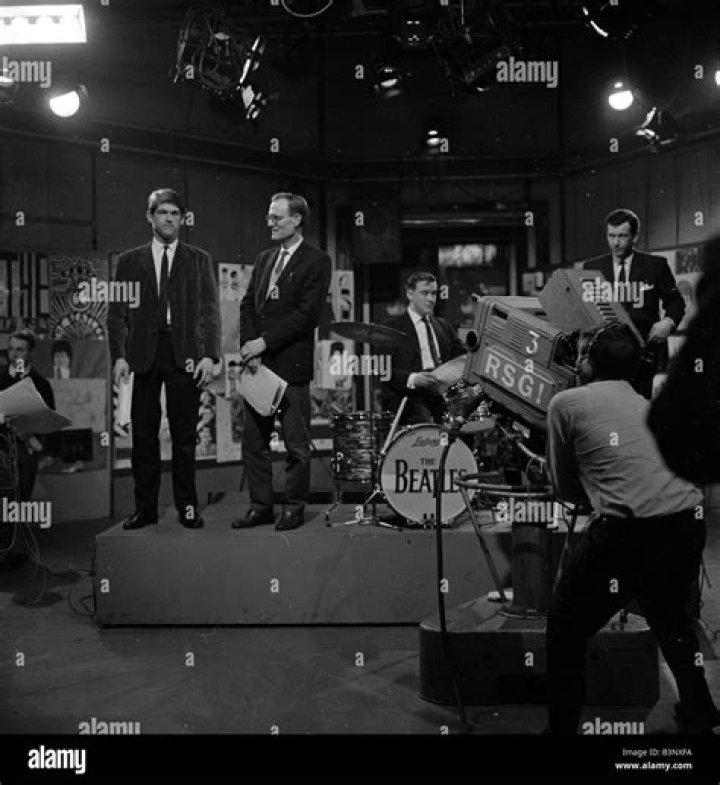 The Beatles at Television House, Kingsway, for an appearance on the television Show "Ready, Steady, Go" Left to right: Paul McCartney, John Lennon, Ringo Starr and George Harrison pictured playing on stage. 20 March 1964.