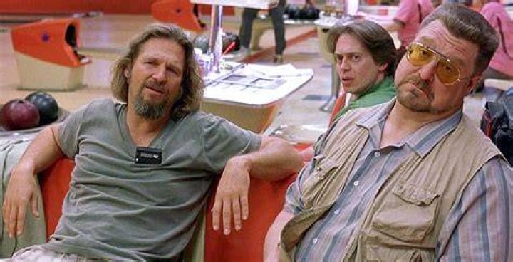 The Big Lebowski sitting behind his desk