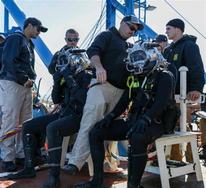 The job is risky; divers spend hours underwater breathing through a hose attached to a pump on the boat above