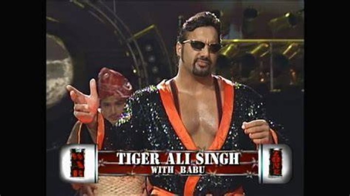 Tiger Ali Singh holding the Indian flag