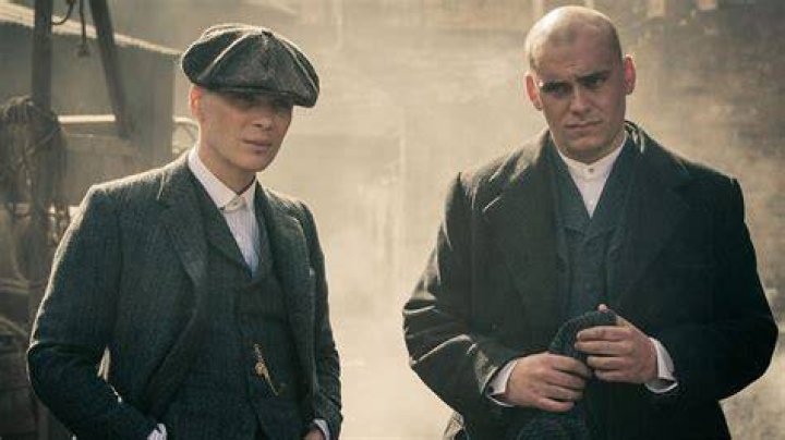 Tommy Shelby and Danny Whizz-Bang walking and talking in Season 1 Episode 1 of Peaky Blinders