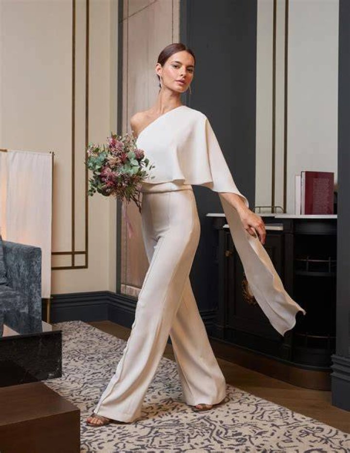 Trousers, Bridal clothing, Textile, Dress, Photograph, Gown, Formal wear, Wedding dress, Purple, Bride, 
