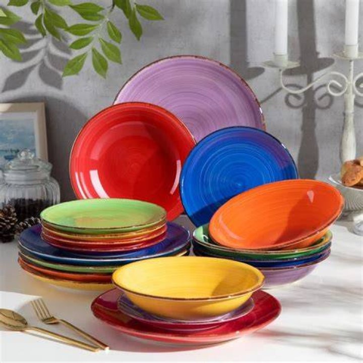 uncooked seitan pieces colourful crockery on decorative surface shallow depth of field