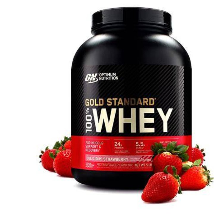 whey protein at gym with young asian man working out his chest muscle in the background