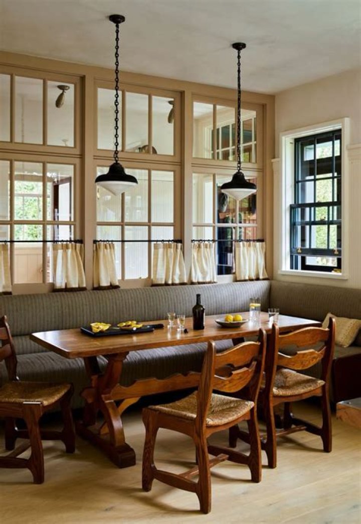 Windowed dining area with glass-topped table