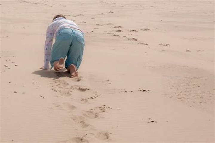 Woman crawling on the sand Stock Photo by &copy;felixtm 3428918