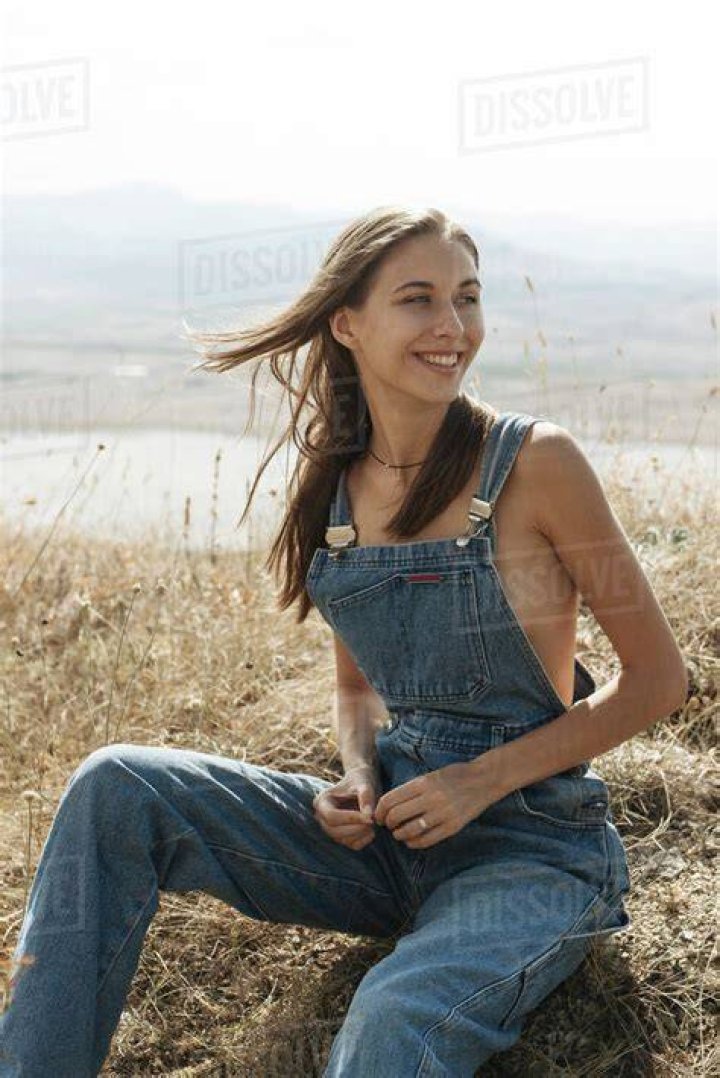 woman wearing overalls and tank top