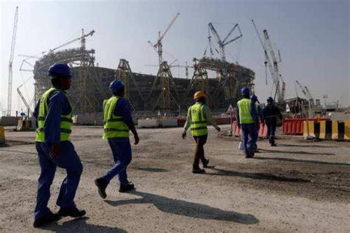 Workers walk to the Lusail Stadium, one of the 2022 World Cup stadiums, in Lusail, Qatar in December 20, 2019. Photo / AP